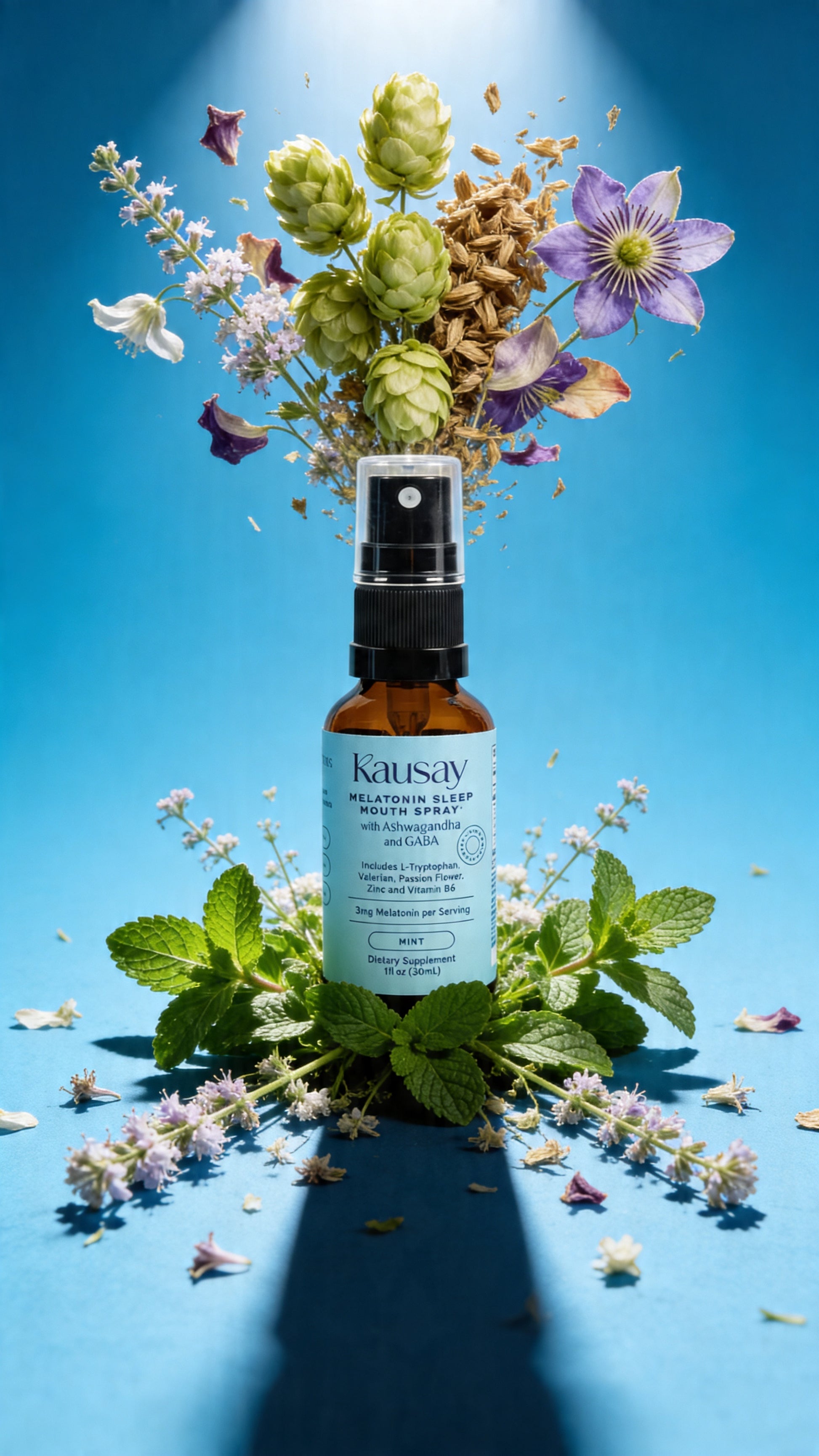Kausay melatonin sleep mouth spray bottle with passion flower, hops, lavender, mint, and valerian flowers suspended mid-air on a blue background